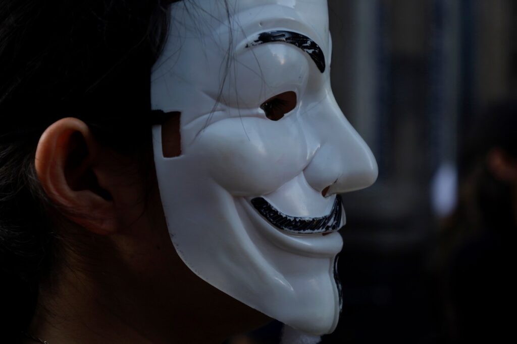 The hacker who humiliated spyware makers and was never caught anonymous hacktivist mask